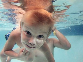 Eric Birmingham, age 6, learns how to swim during a lesson with swimming instructor Owen Murray at the Vollmer Complex in LaSalle, Ont. on Aug. 9, 2016.