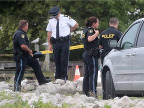 OPP officers investigate a drowning at the Happy Snapper Marina in Leamington, Ont. on Monday, August 15, 2016. A woman on scene said the victim was an elderly boater.
