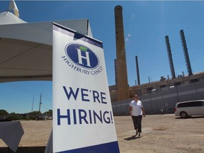 Sharon Antoun of Highbury Canco walks toward job fair tent at Highbury Canco in Leamington Monday Aug. 8, 2016.