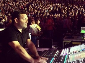 Windsor-born audio engineer Lee Moro works the sound boards for The Tragically Hip's performance at the Air Canada Centre on Aug. 10, 2016.