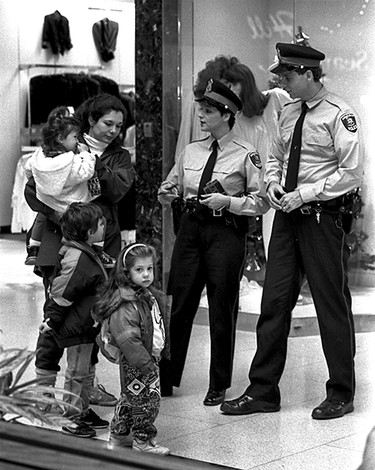 Dec. 4, 1990: Constables Wendy Sarkis and Paul Prior work Devonshire Mall do some public relations with shopper Michele Reiser and her children, Erica, 1 (in mom's arms), Danielle, 3, and Kristopher, 4.