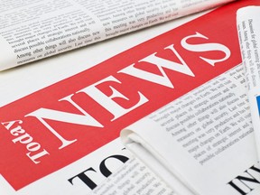 Newspapers stack with news headline. Photo by Getty Images.