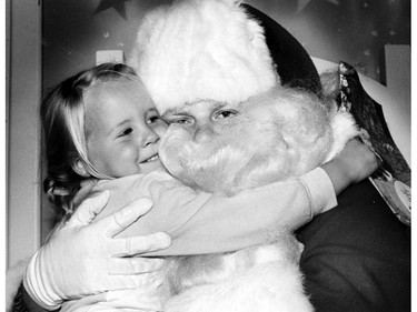 Nov. 18, 1985: Santa a big hug from Stephanie Creede,3, shortly after the jolly gent's arrival at Devonshire Mall.