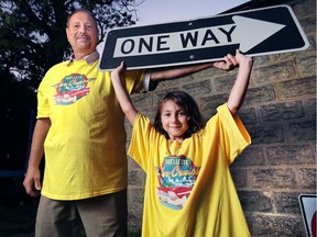 Downtown Windsor Business Improvement Association president Larry Horwitz and his daughter Talya, 6, model the official Ouellette Car Cruise shirt that will be sold at the event which makes its inaugural debut on Friday, August 19, 2016.