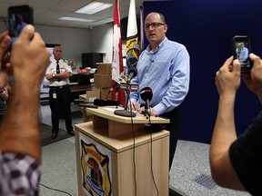 Fire Chief Bruce Montone (left) and Mayor Drew Dilkens brief the media after last night's tornado at the Emergency Operations Centre in Windsor on Thursday, August 25, 2016. (TYLER BROWNBRIDGE / WINDSOR STAR)