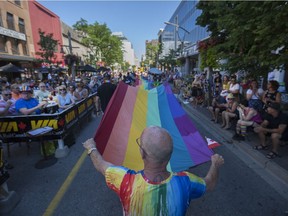 The Windsor Essex Pride Festival parade makes its way down Ouellette Ave., Sunday, August 7, 2016.