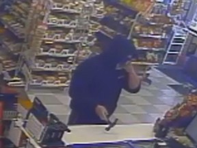 A suspect wanted in connection with a robbery at a convenience store in the 1100 block of Lauzon Road in Windsor is pictured in this surveillance photo.