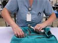 A staff member at the Windsor Regional Hospital Met campus in the medical device reprocessing department prepares sterilized medical equipment for OBGYN surgery on Tuesday, Aug. 23, 2016.