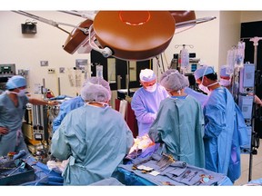 Surgeons at work in operating room. Surgery. Photo by Getty Images.