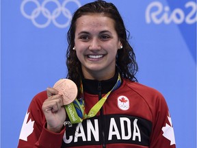 LaSalle's Kylie Masse, seen posing with her bronze medal at the 2016 Olympic Games, was one of several local athletes backing the Canadian Olympic Committee's decision to pull out of the scheduled 2020 Tokyo Olympic Games because of the COVID-19 pandemic.