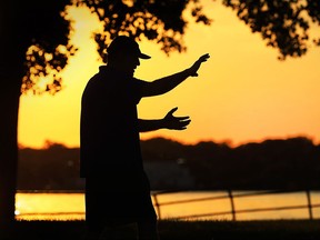 Bert Desjardins practices tai chi as the sun sets at the Kiwanis Park in Windsor on Monday, Aug. 29, 2016.