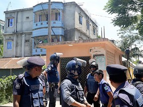 Bangladesh Police are shown in front of an apartment near Dhaka where they killed three suspected militants on Aug. 27, 2016, including Tamim Chowdhury, who once lived and went to school in Windsor, Ont.