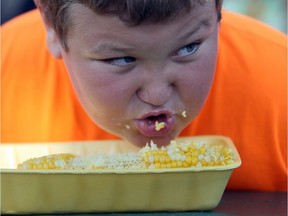 Marc Morassutti, 11, competes in the corn eating contest at the 41st annual Tecumseh Corn Festival at Lacasse Park on Friday, Aug. 26, 2016.