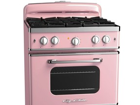 This photo provided by Big Chill shows an oven in the color of pink lemonade. With strong color trending in kitchens, Big Chill's vibrant hues in fridges, ovens and range hoods hit the style mark. As a pop of color in an otherwise low key kitchen, or as part of an overall exuberant space, appliances like these, particularly with some retro details, stand out from the standard stainless offerings. (AP Photo/Big Chill) ORG XMIT: NYLS566