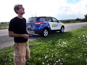 Mark Robinson, a storm chaser with The Weather Network stops near West Lorne, Ontario while tracking storms in southwestern Ontario on August 25, 2016.