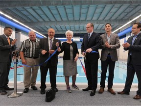 WINDSOR, ON. JUNE 16, 2016 -  A ribbon cutting ceremony was held at the WFCU Centre community pool on Thursday, June 16, 2016, in Windsor, ON. The 25 metre pool was completed two months ahead of schedule. From left, Eddie Francis, former mayor and current WFCU president, Don Sadler, pool project manager, Ed Sleiman, Jo-Anne Gignac, city councillors, Drew Dilkens, mayor, Max DeAngelis, president DeAngelis Construction and Irek Kusmierczyk, city councillor cut the ribbon during the event. (DAN JANISSE/The Windsor Star) (For story by Craig Pearson)