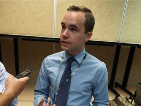 Mackenzie Slifierz, an epidemiologist at the Windsor-Essex County Health Unit, explains a suicide report he helped author, during a news conference in Windsor on Aug. 22, 2016.