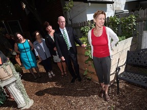 Tamara Kowalska, right, is joined by Tracy Sansom, from left, Maria Caschera, Lori Sheppard and Eric Griggs from TD Canada as she unveils the new teaching garden at the Windsor Youth Centre in Windsor on Tuesday, August 23, 2016.