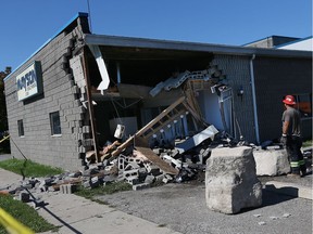 A large hole is seen in the side of Mayson Machining in Windsor on Monday, Aug. 29, 2016. Jerry Cloutier was killed when his minivan collided with the building.