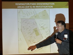 In this photo from April 29, 2015, Randy McKnight points out the Remington Park area during a town hall meeting on the investigation into the cancer cluster.