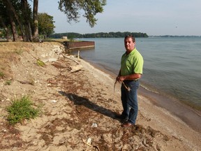 Phil Roberts, Windsor's director of parks, walks along the shoreline of Stop 26 Beach on Aug. 5, 2016. It which lacks the more inviting sands of Sandpoint next door.