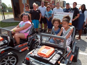 Young drivers Liliana Varacalli, left, and sisters Symone Sims and Ava Sims, right, enjoy new mini-vehicles thanks to a donation of $7,500 from Unifor Local 444 and Local 200 at The Safety Village August 05, 2016.