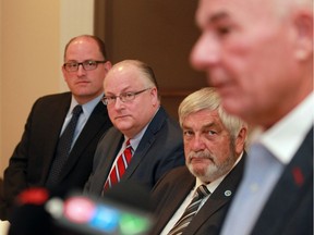 Windsor Mayor Drew Dilkens, left, new CEO for WindsorEssex Economic Development Corp. C. Stephen MacKenzie and Warden Tom Bain listen to WEEDC chair Marty Komsa during a news conference at Best Western Riverfront Hotel Monday August 8, 2016.
