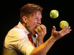 Kobbler Jay, a professional street performer, juggles and eats apples while entertaining the crowd during the 2016 Walkerville Buskerfest kickoff event at the Walkerville Theatre on Aug. 11, 2016.