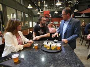 Interim Conservative leader Rona Ambrose, left, and B.C. MP Dan Albas, right, get a tour of Walkerville Brewery by brewer Michael Beaudoin on August 11, 2016.