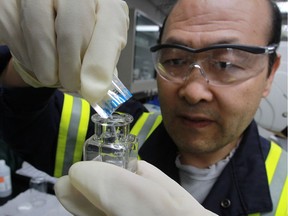 Water operator David Xu conducts a test on Aug. 12, 2016 to determine the concentration of phosphoric acid in treated water at the A.H. Weeks Water Treatment Plant recently.