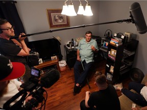 A Vice News production crew interviews Mike Provost at his home in Windsor on Tuesday Aug. 2, 2016 as part of a production about the Windsor Hum.