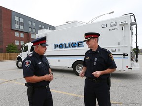 Windsor police Staff Sgt. Jason Crowley, left, and Supt. John St. Louis at the scene of a training session for Windsor police and University of Windsor police officers at Alumni Hall on Aug. 24, 2016. (JASON KRYK/Windsor Star)