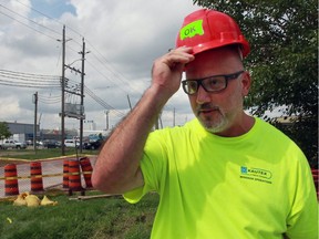 Kautex employee Paul Guidolin takes a break at the plant Wednesday, Aug. 31, 2016. Workers have returned to the auto parts plant a week after a tornado struck the building.