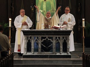 Priest Maurice Restivo leads a mass at Our Lady of Assumption Church in Windsor on Thursday, September 15, 2016. The Diocese of London held masses for the victims of clergy sexual assault. (TYLER BROWNBRIDGE / WINDSOR STAR)