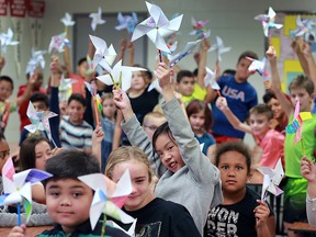 Students from Dougall Public School made a colourful expression of their feelings about living in peace, on Wednesday, Sept. 21 in Windsor, ON. It was the International Day of Peace as designated by the United Nations. Working with members of Rotarians from Club 1918, students in Grades 4, 5 and 6 created pinwheels. Millions of students throughout the world have created Pinwheels for Peace as a symbol for the special day. Students are shown with their pinwheels. (DAN JANISSE/The Windsor Star)