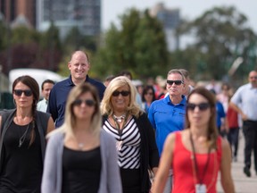 Windsor mayor, Drew Dilkens, left, and Caesars Windsor president, Kevin Laforet, are joined by employees from the City of Windsor and Caesars Windsor for a 1 km walk, Wednesday, September 21, 2016. The goal is to encourage employees and members of the community to meet personal health and exercise goals by becoming more active on their lunch break. (DAX MELMER/The Windsor Star)