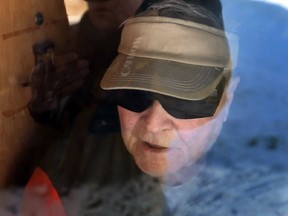 In this Feb. 10, 2011 file photo, Richard James Massen talks through his front door to reporters at his home on Meloche Road in Amherstburg.