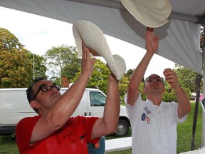 Pizza chefs Lucio Franceschelli, left, and Remo Tortola of Giovanni Caboto Club shape pizza dough at the Windsor-Essex Harvest Festival at Fort Malden September 9, 2016.