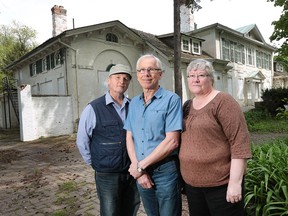 Paul Hertel, left, Robert and Debra Honor, members of the Belle Vue Cultural Foundation, are shown in front of the historic Belle Vue House in Amherstburg on Tuesday, May 17, 2016.