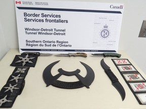 Knives, throwing stars and knifed throwing cards seized at the Windsor-Detroit Tunnel are pictured in this handout photo.