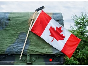 Canadian flag on a military vehicle. Photo by Getty Images.