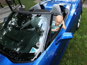 Mahdi, a four-year-old patient of Windsor Regional Hospital's Paediatric Oncology Unit, tries out the driver seat of a 2014 Corvette Stingray convertible on Sept. 8, 2016. The Corvette Club of Windsor brought several cars to the Met Campus to celebrate the club's monetary donation to the unit.
