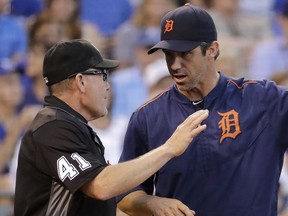 Detroit Tigers manager Brad Ausmus talks to home plate umpire Jerry Meals during the fifth inning of a game against the Kansas City Royals on Sept. 3, 2016, in Kansas City, Mo.