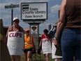 In this file photo, members of CUPE Local 2974 representing Essex Library workers, walk the picket line at Essex Branch on Arner Townline on June 27, 2016.