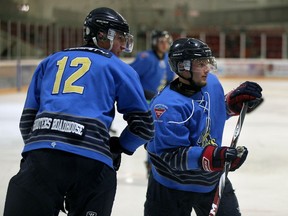 Amherstburg Admirals Marshal Laing, left, and Casey Basile keep an eye on the action against the Essez 73's during junior C hockey action at the Essex Centre Sports Complex September 13, 2016.