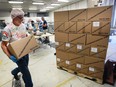 Workers at Southwestern Ontario Gleaners of Leamington prepare to send 340,000 servings of vegetable soup mix Thursday to Haiti. The organization Enable Haiti is shipping the food to about 900 orphans living in the impoverished island nation.