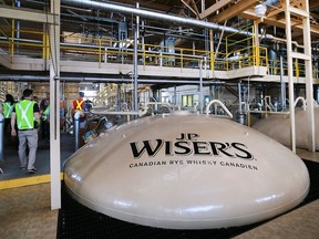 Fermentation tanks are shown at the Hiram Walker and Sons distillery on Sept. 14, 2016.