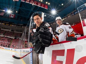 Shawn Horcoff #22 of the Anaheim Ducks swipes the pucks off the dasher before a game against the Detroit Red Wings at Joe Louis Arena on January 23, 2015 in Detroit, Michigan.