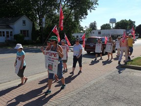 Striking library workers and members of CUPE walk the picket line in front of the Harrow Library on Monday, July 25, 2016. The county is saving $35,000 a week during the 12-week strike that has shut down 14 library branches.