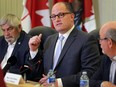 Lakeshore Mayor and Essex County Warden Tom Bain, left, Windsor Mayor Drew Dilkens, centre, and Tecumseh Mayor Gary McNamara address the media during a news conference on Friday, Sept. 30, 2016.